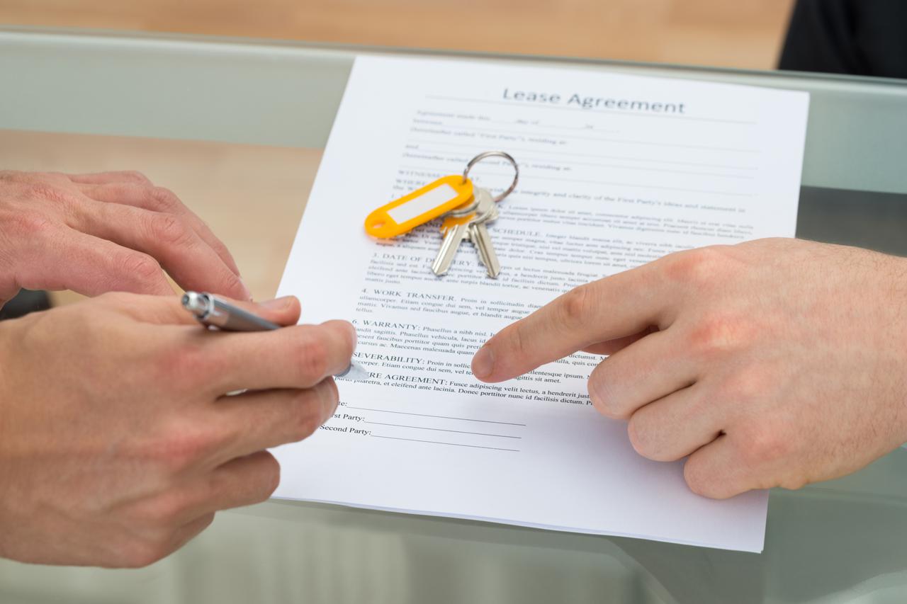 Person Signing Lease Agreement